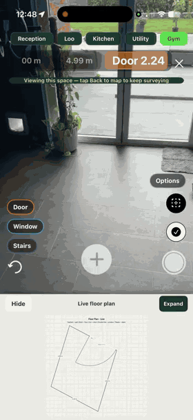 Walking room to room in SiteSurvey — each space named along the top and the live floor plan building underneath as the walk continues
